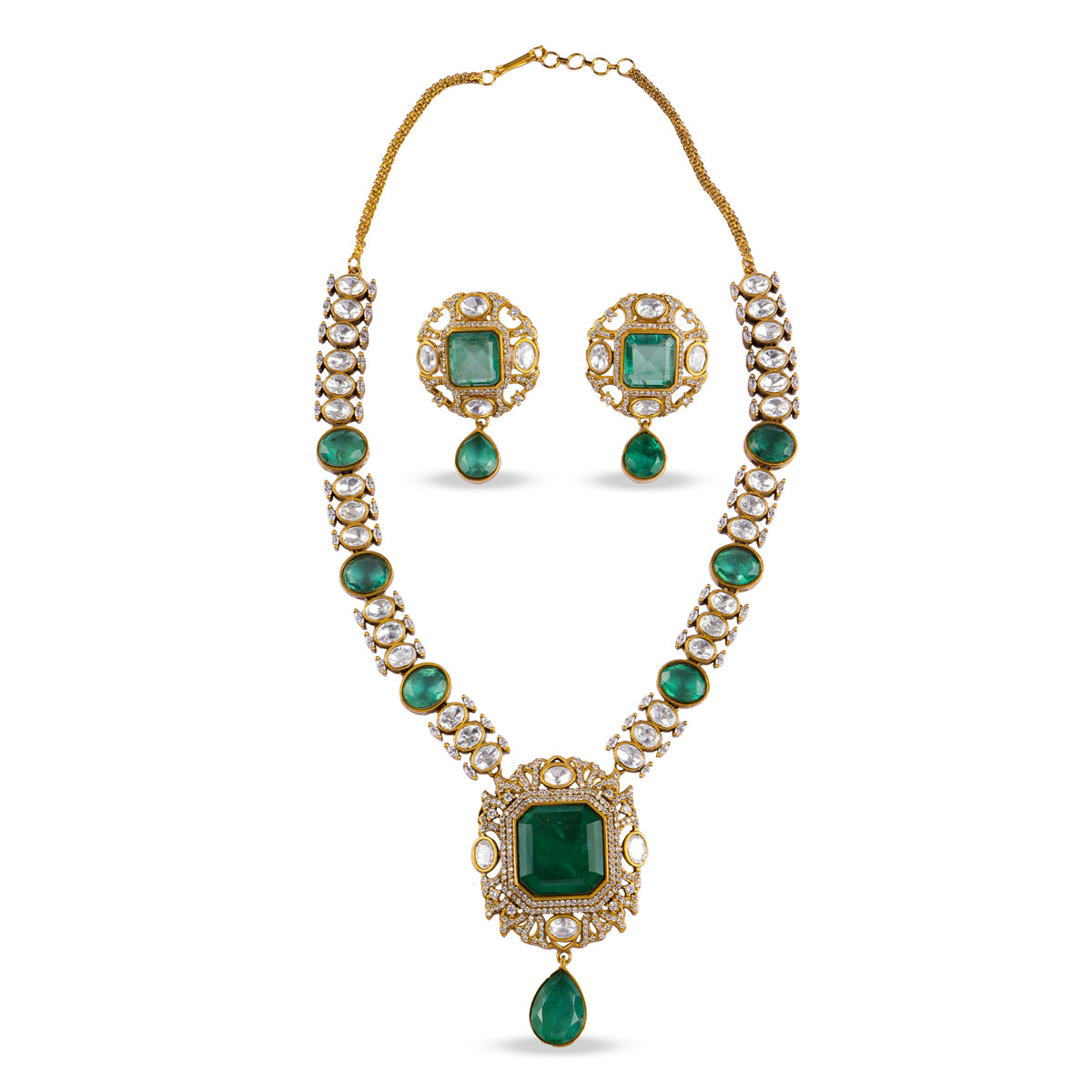 Emerald green kundan necklace set with matching earrings, featuring gold detailing and teardrop pendant – handcrafted luxury jewellery by Atelier Maharanibagh.