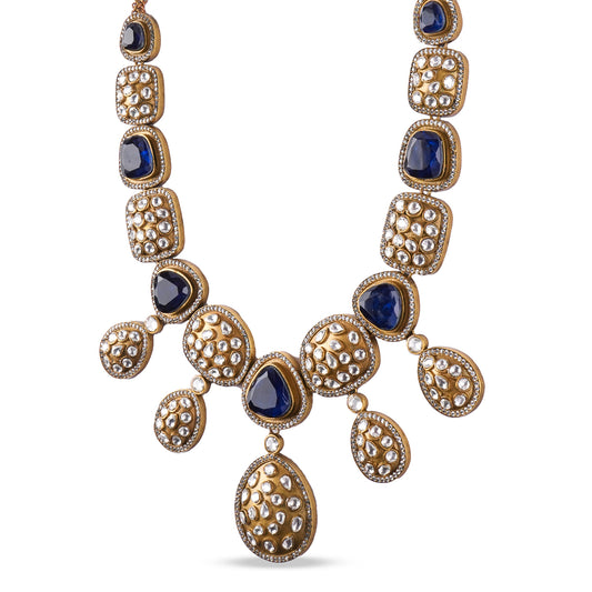 Handcrafted kundan necklace set with deep sapphire blue stones and matching earrings in gold finish – luxury statement jewellery by Atelier Maharanibagh.