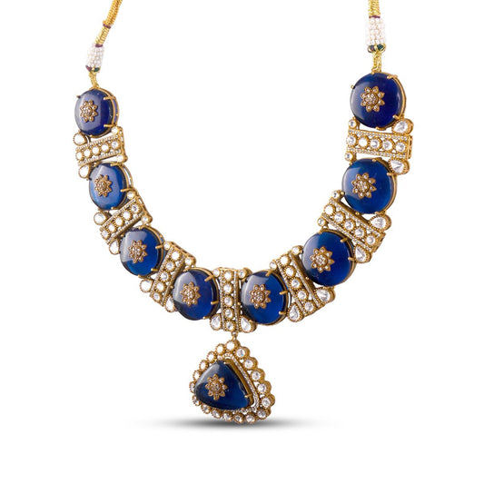 Royal blue kundan necklace set with diamond-studded floral motifs and matching earrings – handcrafted luxury jewellery by Atelier Maharanibagh.
