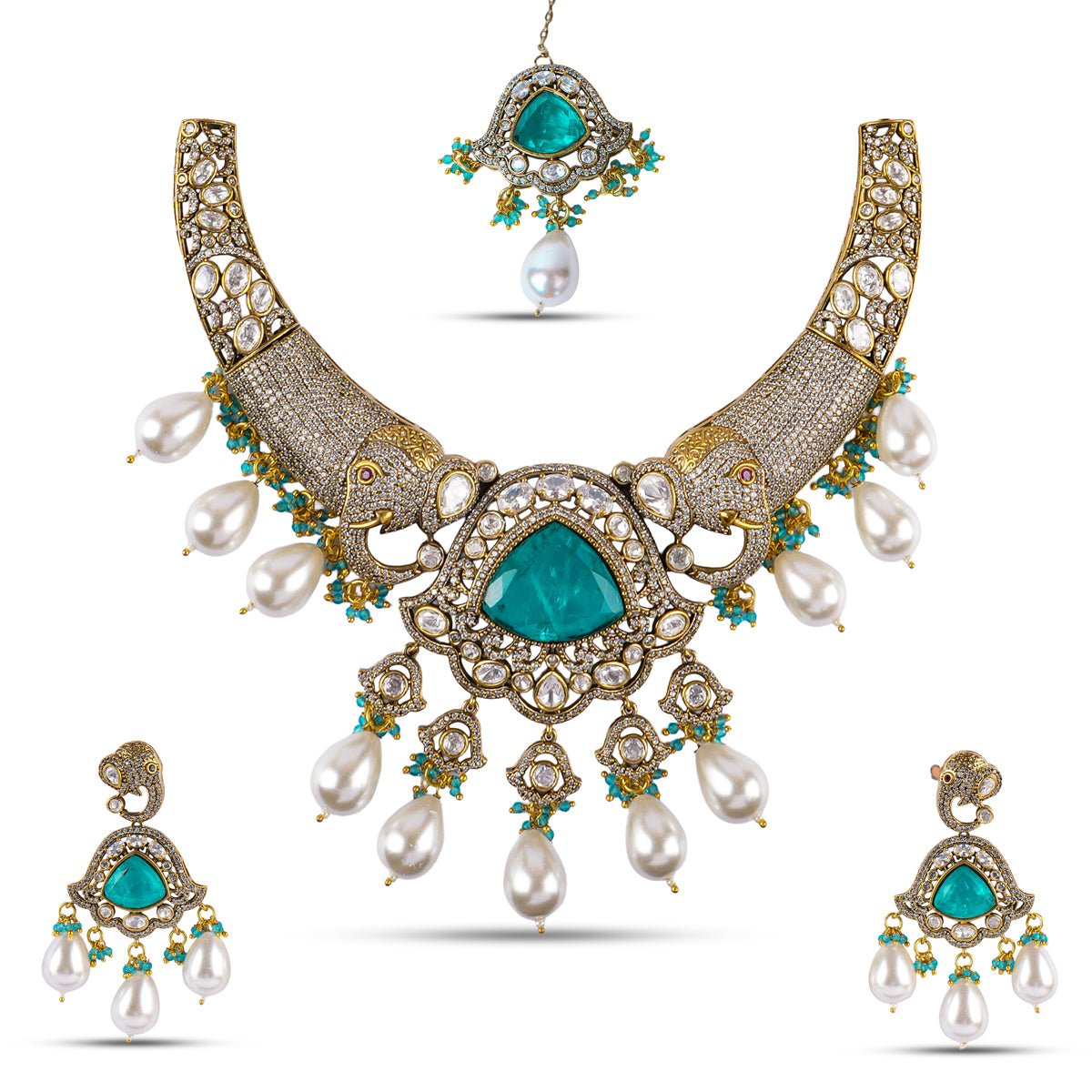 Emerald and pearl kundan necklace set with elephant motifs, featuring intricate gold detailing and matching earrings – handcrafted royal jewellery by Atelier Maharanibagh.